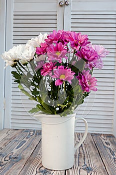 Bouquet of carnations in a vase in the style of Provence