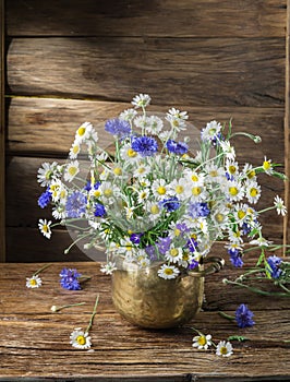 Bouquet of chamomiles and cornflowers