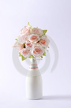 Bouquet of chic pink flowers in a champagne bottle