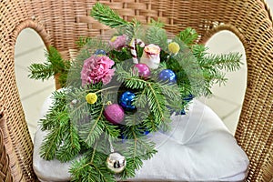 Bouquet of Christmas tree with Christmas decorations and live carnations and roses