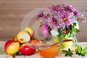 Bouquet of chrysanthemum, apples and flower honey
