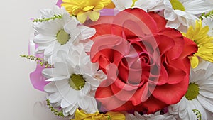 Bouquet of chrysanthemums and roses on a white background.