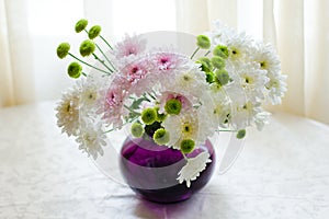 Bouquet of chrysanthemums in a vase photo