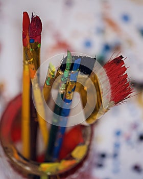 Bouquet of colored brushes after painting.