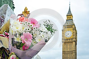 Bouquet of colorful flowers with Big Ben in background. London, UK