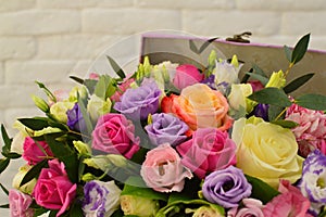 Bouquet of colorful flowers in vintage hat box
