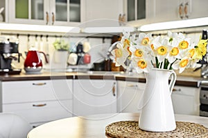Bouquet of daffodils in interior of the kitchen