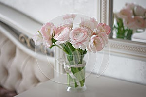 Bouquet of delicate ranunculus and tulips in