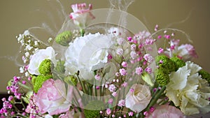 Bouquet from different flowers on the table.