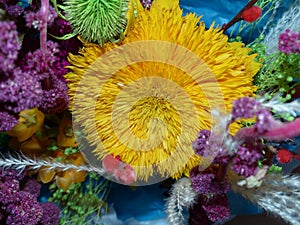 Bouquet of dried flowers and herbs. Colorful bouquet of dried flowers with your own hands. Autumn still life.