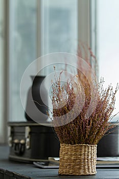 Bouquet of dried flowers on the windowsill