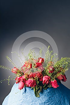 Bouquet of dried pink roses, dark background