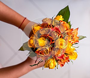 Bouquet of dried roses in hands