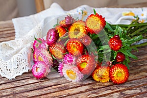 Bouquet of Everlasting flowers on table