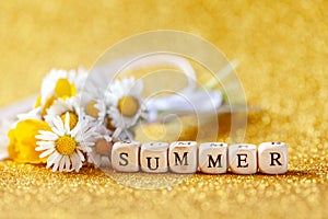 Bouquet flower camomila with text summer on yellow background photo