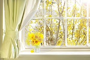 Bouquet of flower on a windowsill