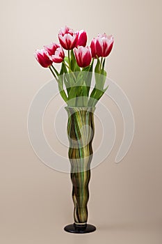 A bouquet of flowers in an artistic vase.