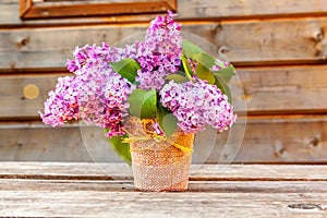 Bouquet of flowers beautiful smell violet purple lilac on rustic wooden background