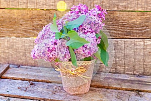 Bouquet of flowers beautiful smell violet purple lilac on rustic wooden background