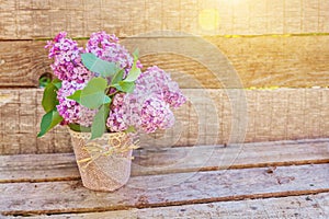 Bouquet of flowers beautiful smell violet purple lilac on rustic wooden background