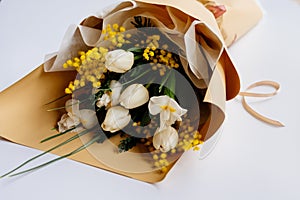 Bouquet of flowers in beige package