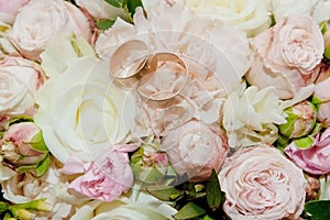 Bouquet of flowers. The bride`s bouquet. Bridal bouquet. Floristics. Wedding rings. Wedding bouquet from different colors