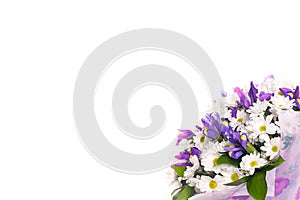 Bouquet of flowers from chamomiles and irises on a white background