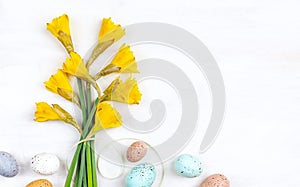 Bouquet of flowers and easter colored eggs.