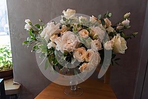 Bouquet of flowers on a leg in the interior of the restaurant for a celebration shop floristry or wedding salon