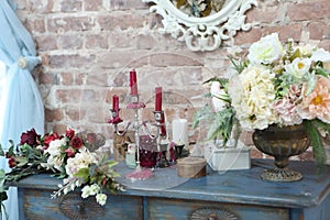 A bouquet of flowers on an old shelf