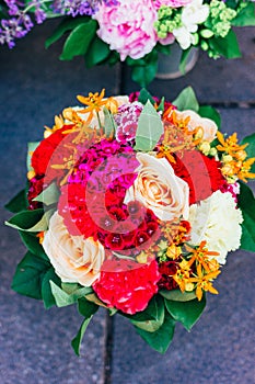 A bouquet of flowers of roses and carnations closeup