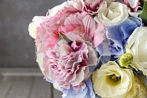 Bouquet of flowers in silver watering can