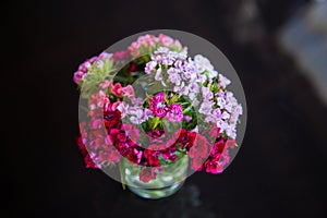 Bouquet of flowers in small glass vase