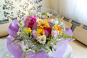 Bouquet of flowers on table in the room