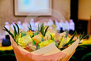 Bouquet of flowers to congratulate the singer. Beautiful flowers for the participant of vocal competition. Bouquet of roses in the