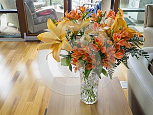 Bouquet of flowers in a vase on a table in the living room