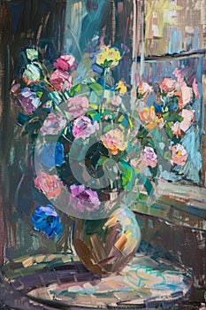 Bouquet of flowers in a vase on the windowsill