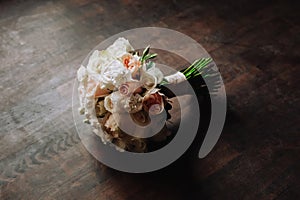 Bouquet of flowers on a wooden background: wedding detail