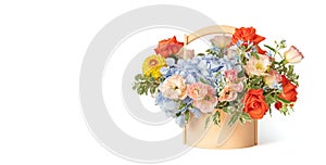 Bouquet of flowers in a wooden basket isolated on a white background. Spring flowers. Roses, eustoma, hydrangea composition. Space
