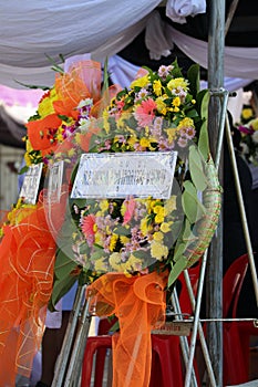 A bouquet of flowers, wreaths, wreaths pay respects at a funeral ceremony at a Thai temple, Thailand.