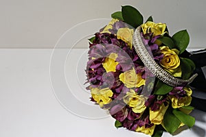 Bouquet of flowers with yellow roses and bow for hair photo