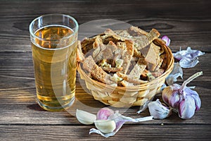 Bouquet of fresh beer and snacks with homemade, salted, rye rusks with garlic for beer.