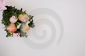 a bouquet of fresh flowers on a white background with a place for text. photo