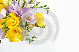 Bouquet of fresh freesia flowers on white, top view