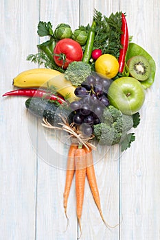 Bouquet of fresh fruits and vegetables on wooden board healthy diet lifestyle concept