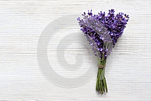 Bouquet of Fresh natural lavender on a white wooden background. Banner, top view, place for text