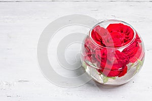 Bouquet of fresh red roses in glass vase