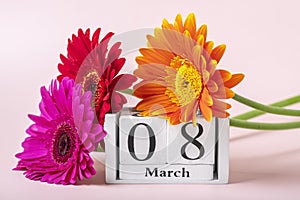 Bouquet of gerbera flowers, calendar with date 08 march on pink background Holiday greeting card International womens