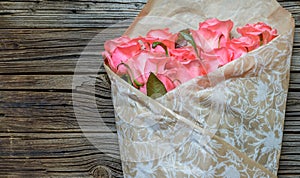 Bouquet of gift wrapped pink roses