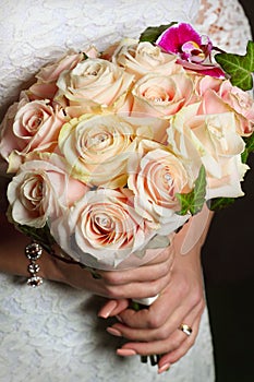 Bouquet in the hands of the bride